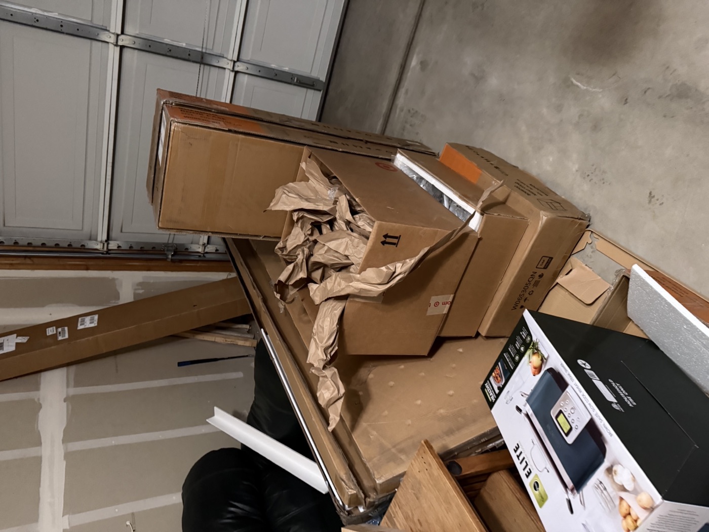 Piled up junk and boxes before cleanout in Northern Colorado