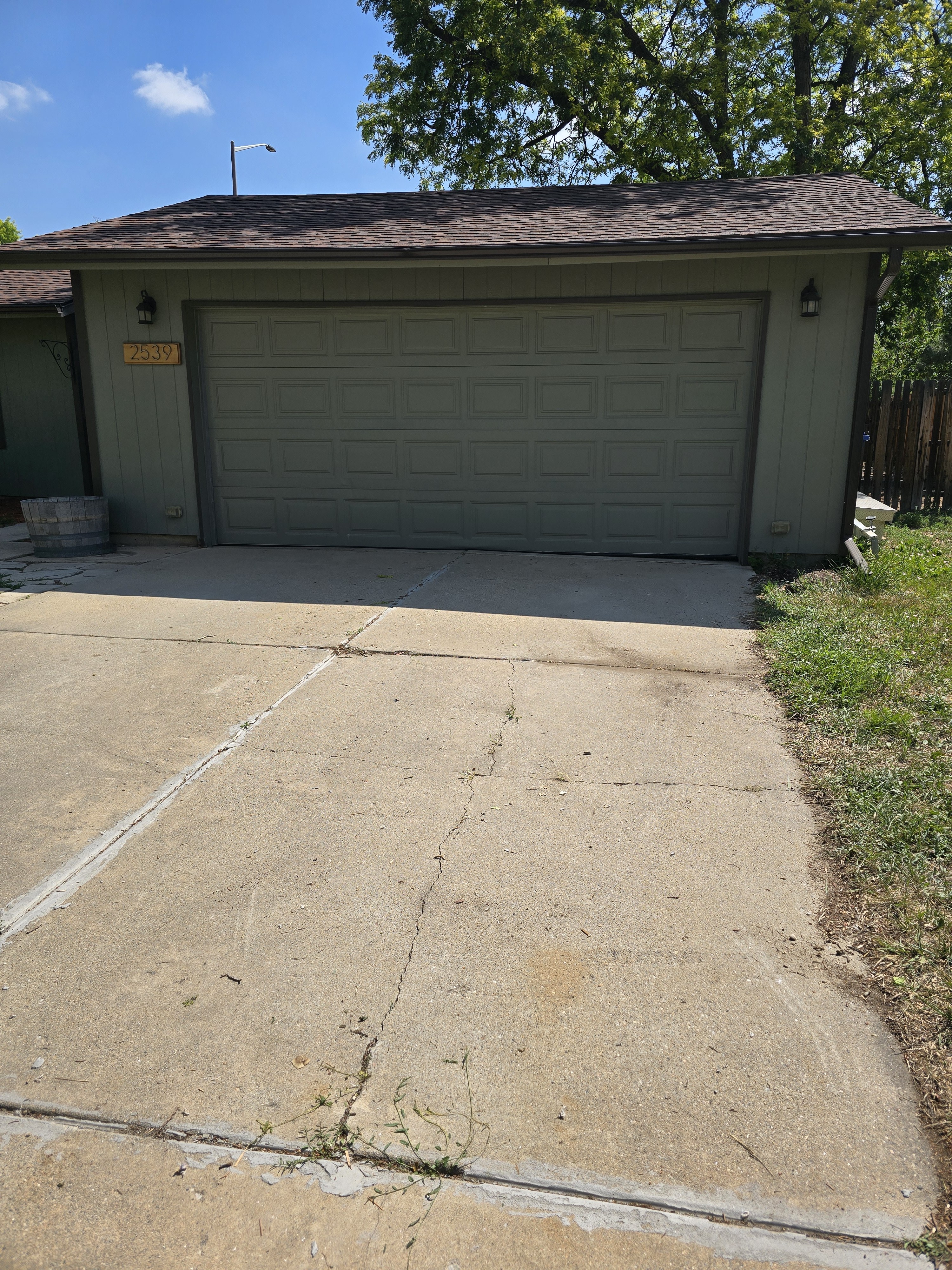 Driveway and garage cleared after construction debris removal in Northern Colorado