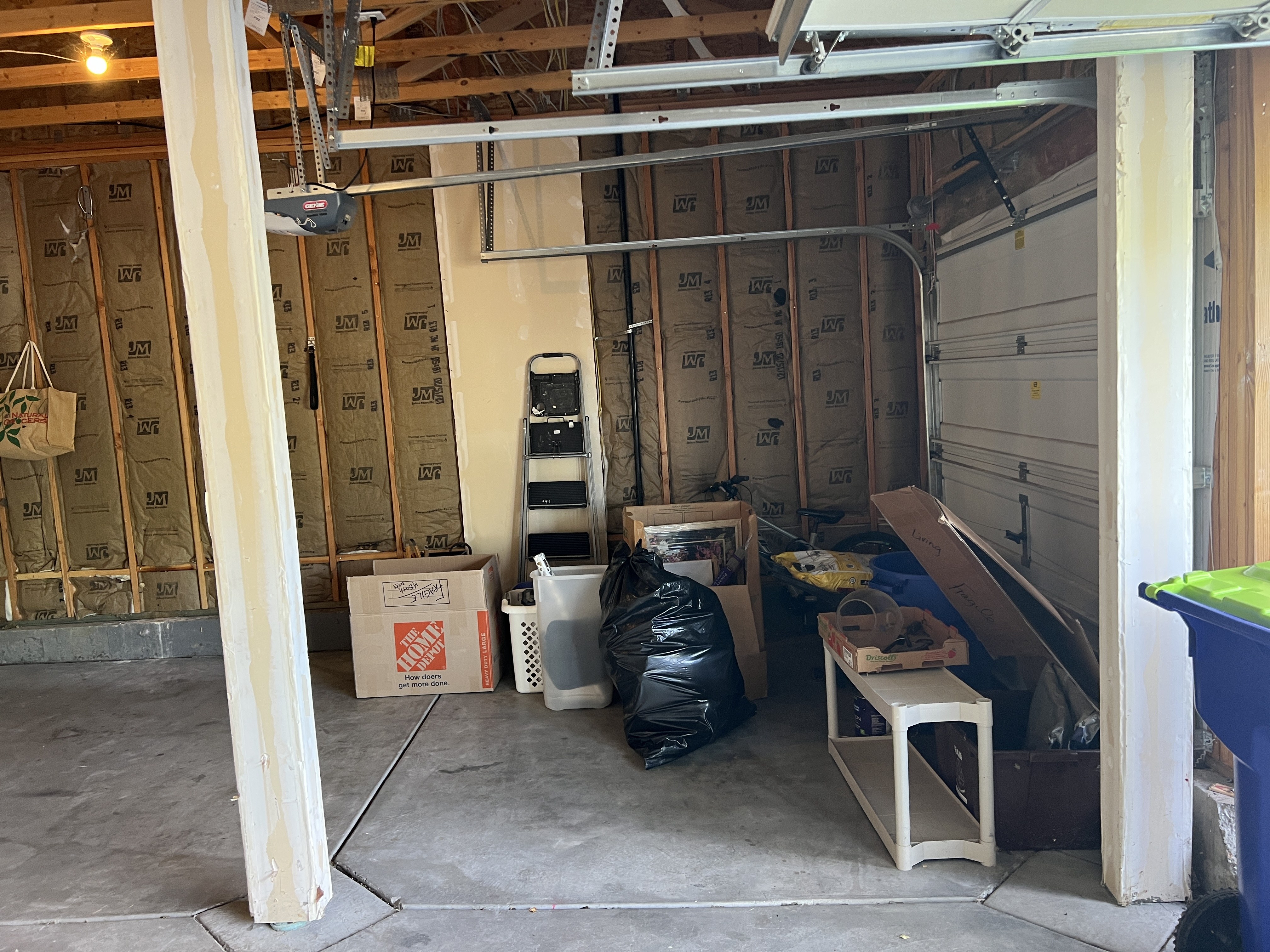 Garage with boxes and junk before cleanout in Northern Colorado