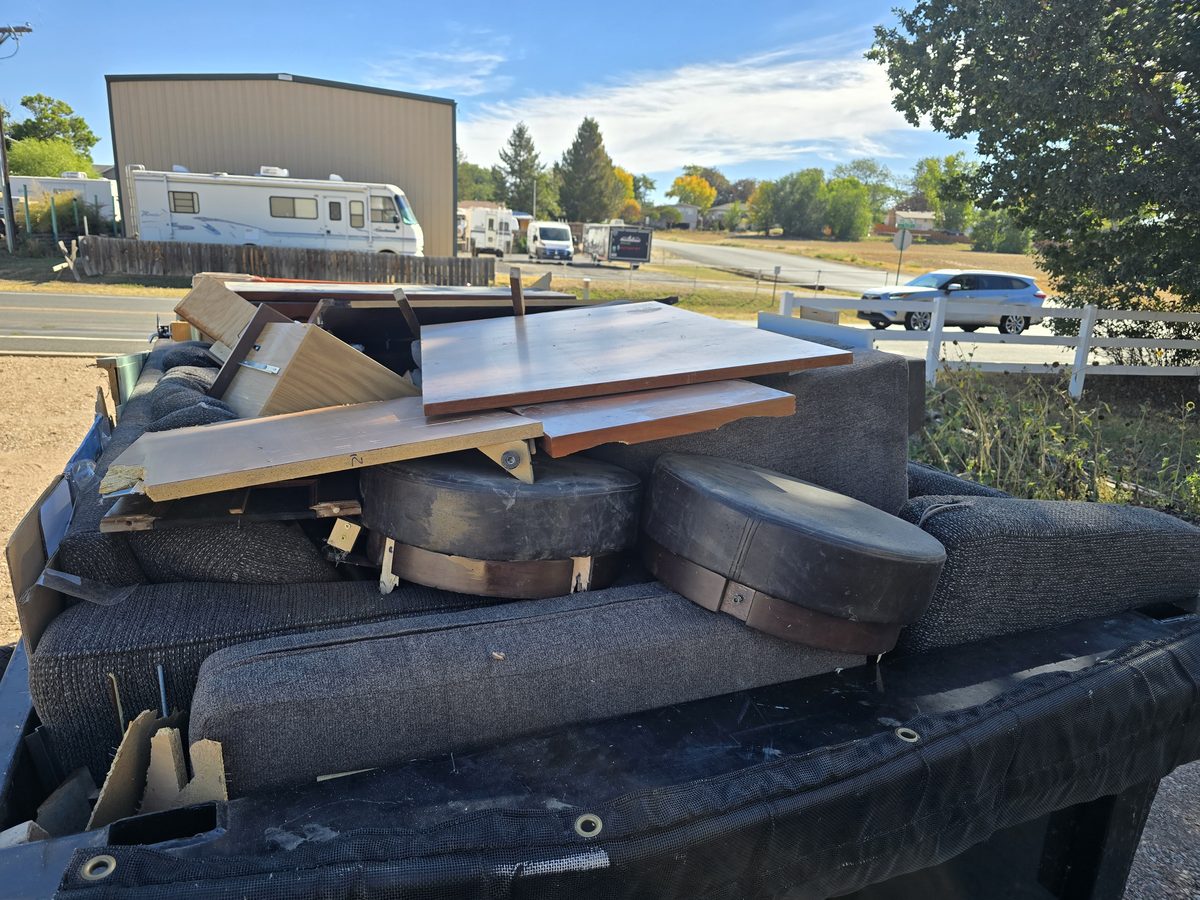 Close-up of a trailer loaded with couch cushions and furniture in Northern Colorado