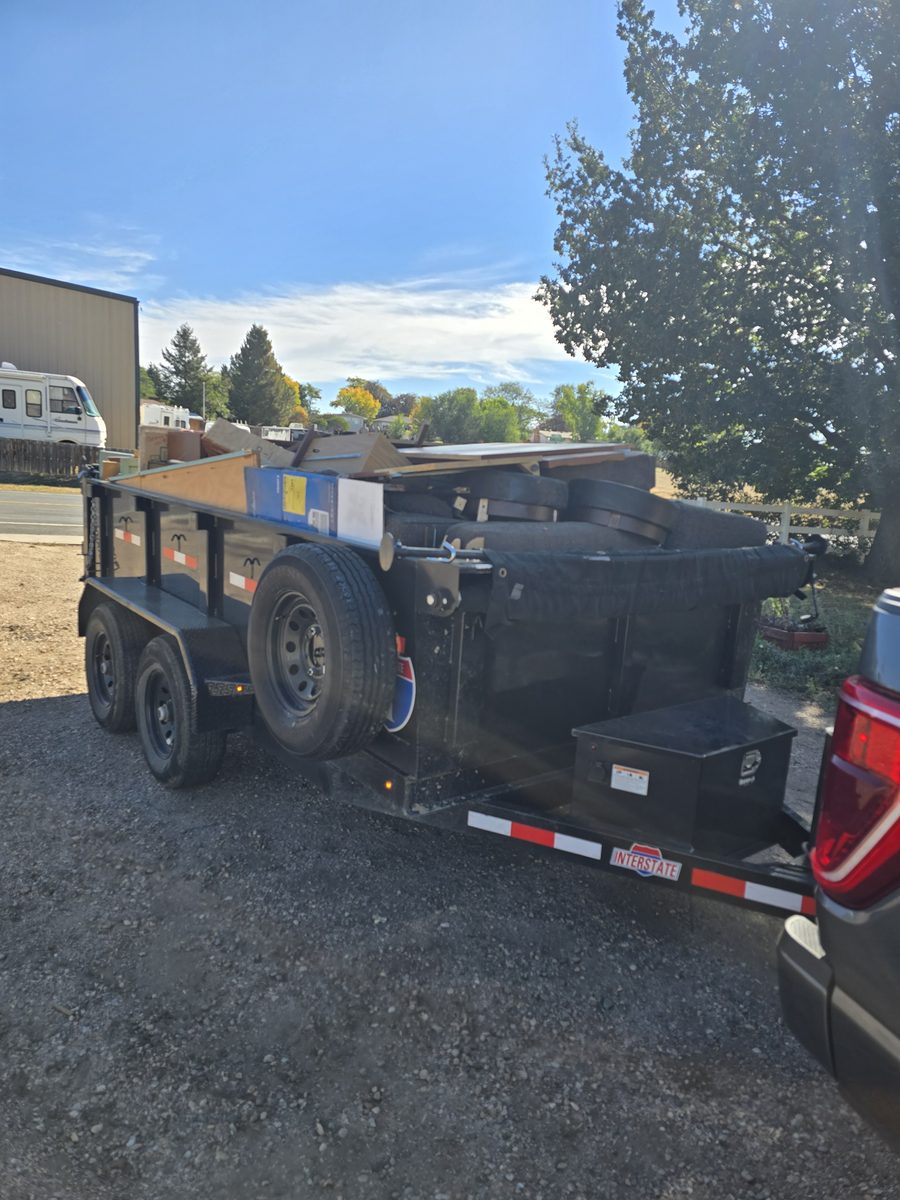 Trailer loaded with furniture and debris ready to haul away in Northern Colorado