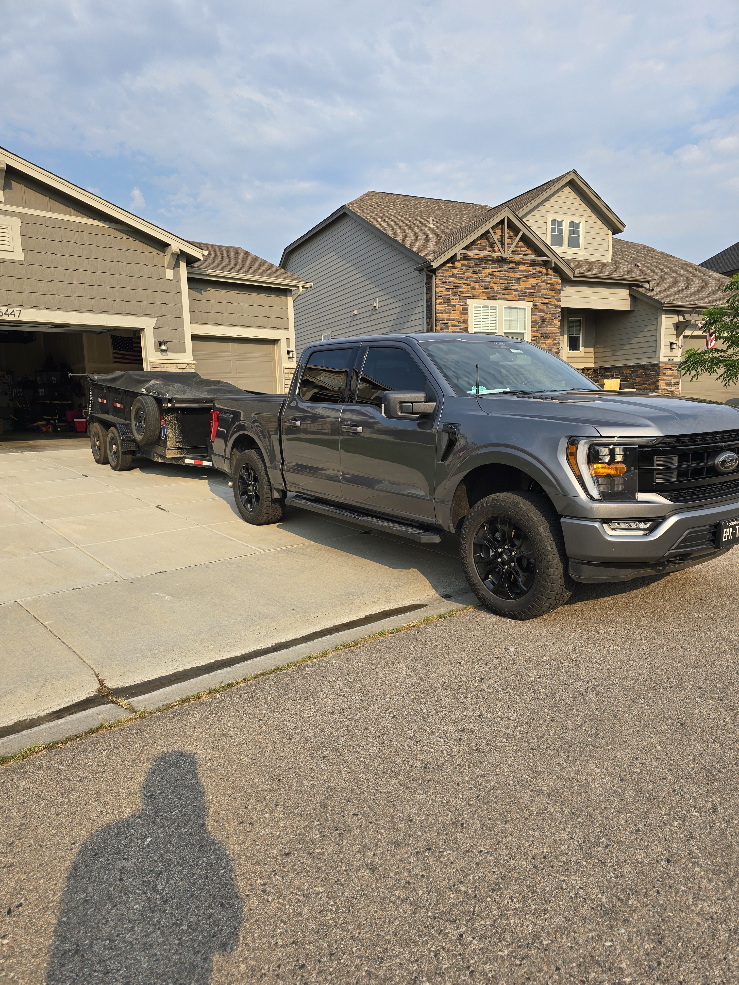 Northern Colorado Junk Removal truck and trailer at a residential job in NoCo