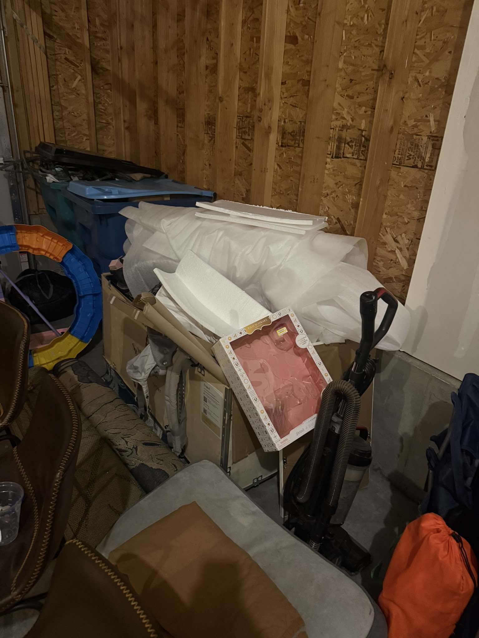 Cluttered shed packed with boxes and items before junk removal in Northern Colorado