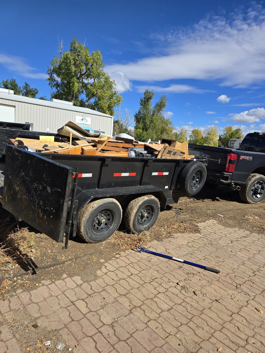 Trailer loaded with wood debris and carpet hauled away in Northern Colorado